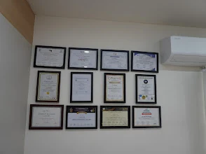Certificates wall at Amay Skin Clinic